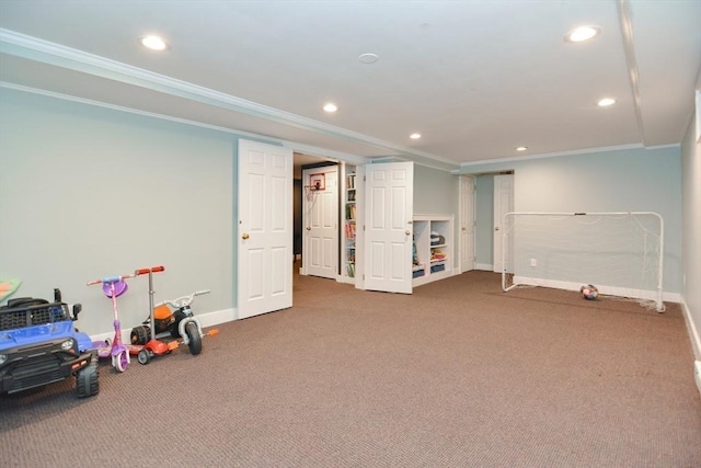 rec room featuring carpet floors, ornamental molding, and baseboards