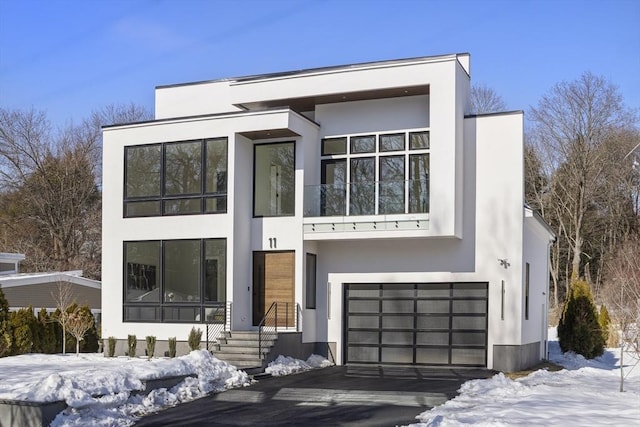 contemporary home featuring an attached garage and stucco siding