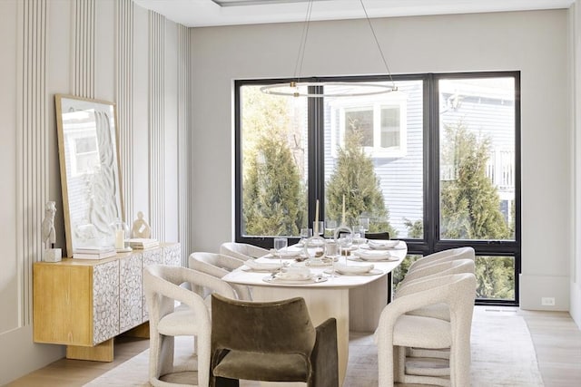 dining space with light wood-style flooring