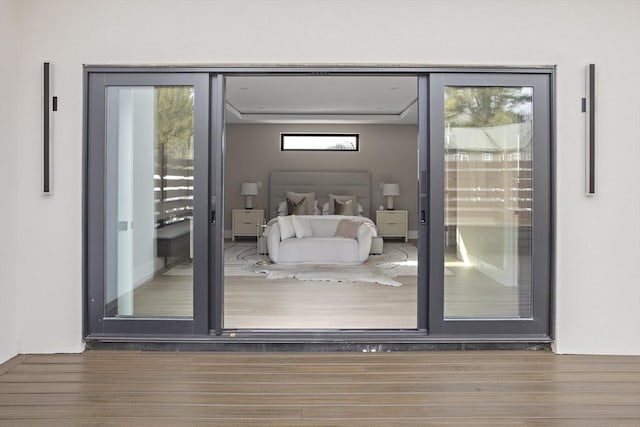 doorway to outside with dark wood-style floors