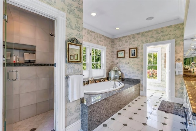 bathroom featuring plus walk in shower and a healthy amount of sunlight