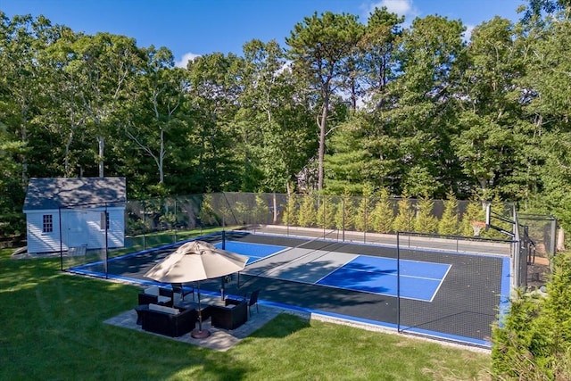 view of sport court featuring a yard and tennis court