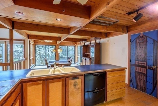 20 Lawton Rd, Leverett, MA 01054 - kitchen with a sink, brown cabinets, wooden ceiling, light wood-style floors, and beamed ceiling
