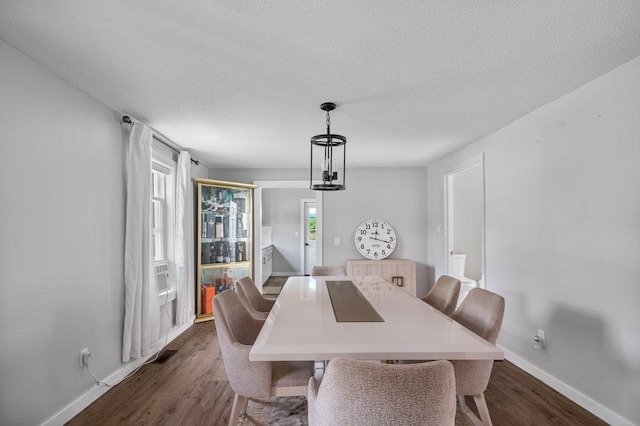 4002 Church St, Palmer, MA 01069 - dining area featuring dark wood-type flooring, a textured ceiling, and cooling unit