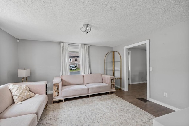 4002 Church St, Palmer, MA 01069 - living room featuring wood finished floors and a textured ceiling