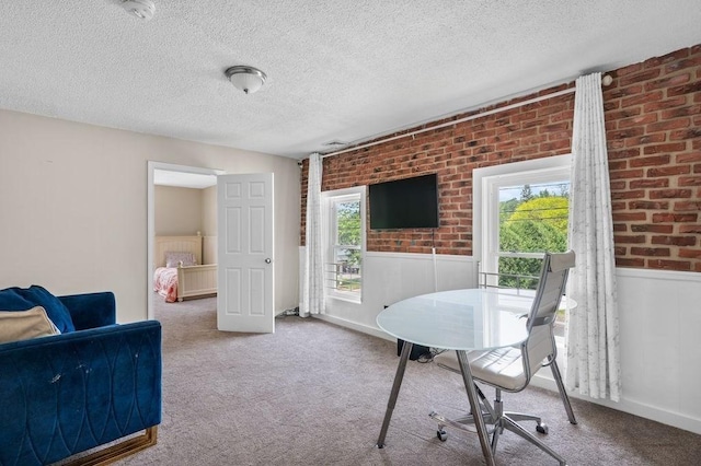 4002 Church St, Palmer, MA 01069 - home office featuring healthy amount of natural light, a wainscoted wall, carpet, a textured ceiling, and brick wall
