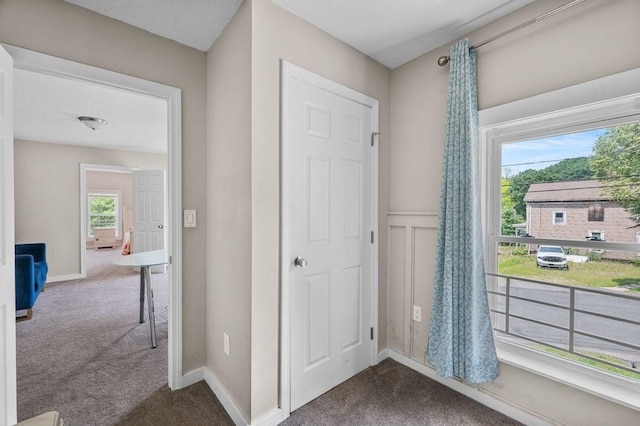 4002 Church St, Palmer, MA 01069 - hallway featuring dark colored carpet and baseboards