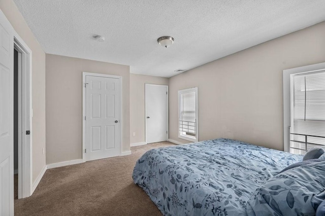 4002 Church St, Palmer, MA 01069 - carpeted bedroom featuring baseboards and a textured ceiling