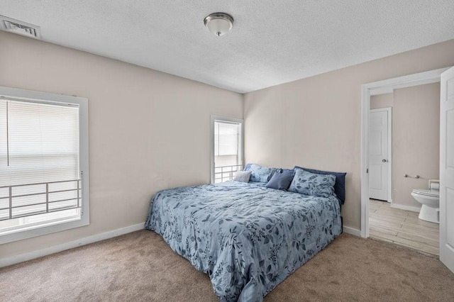 4002 Church St, Palmer, MA 01069 - carpeted bedroom featuring a textured ceiling and baseboards