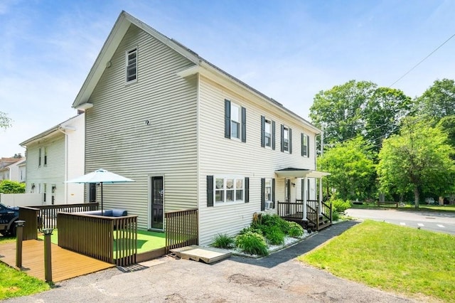 4002 Church St, Palmer, MA 01069 - view of side of home featuring a wooden deck and a lawn