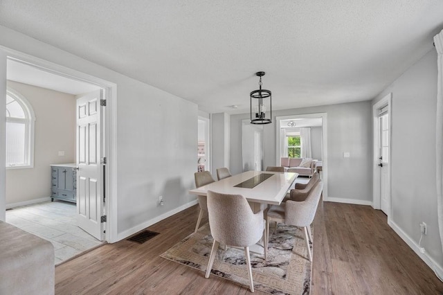4002 Church St, Palmer, MA 01069 - dining area featuring wood finished floors and a textured ceiling