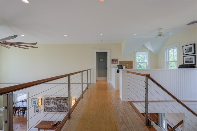 1794 Drift Unit E, Westport, MA 02790 - hall with an upstairs landing, recessed lighting, light wood-style flooring, and vaulted ceiling