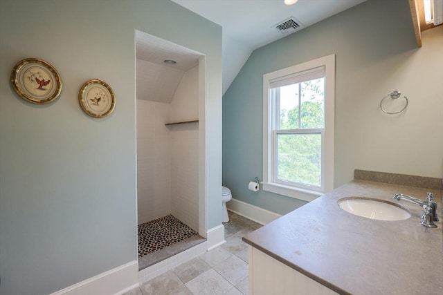 1794 Drift Unit E, Westport, MA 02790 - bathroom with tiled shower, lofted ceiling, vanity, and tile patterned floors