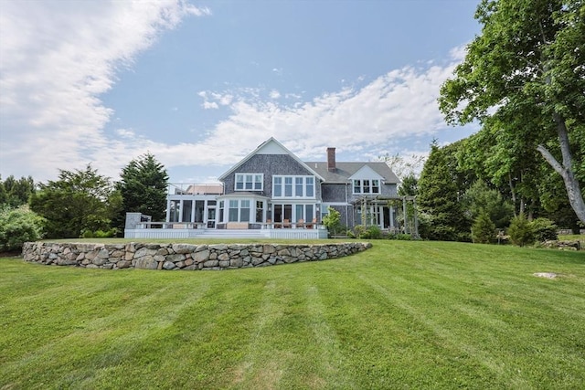 1794 Drift Unit E, Westport, MA 02790 - rear view of house with a chimney, a yard, and a sunroom