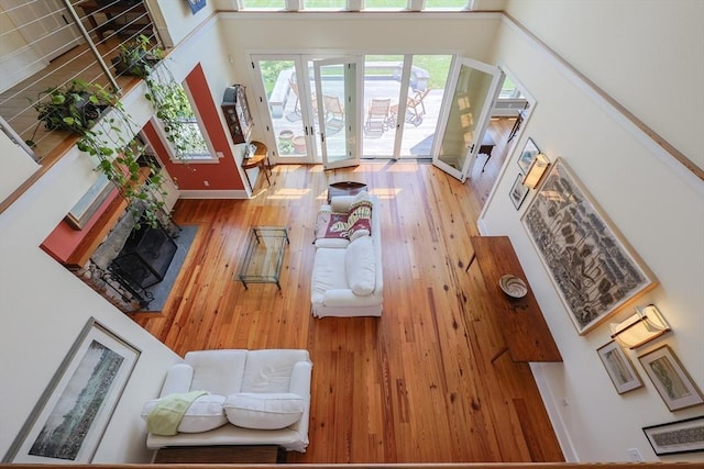 1794 Drift Unit E, Westport, MA 02790 - living room featuring wood finished floors, a towering ceiling, and french doors