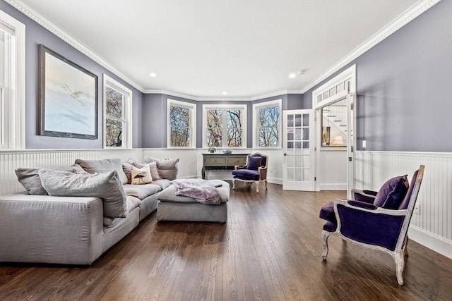 living area with ornamental molding, dark wood-type flooring, a wainscoted wall, and recessed lighting