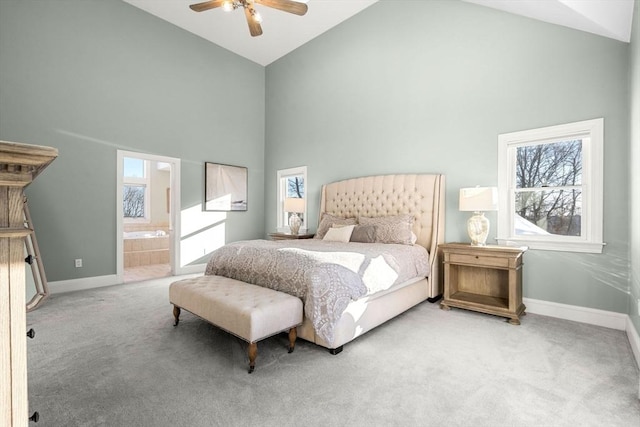 bedroom featuring high vaulted ceiling, carpet flooring, and baseboards