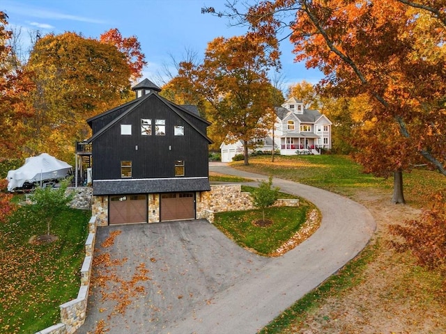 view of front facade featuring stone siding and a front lawn
