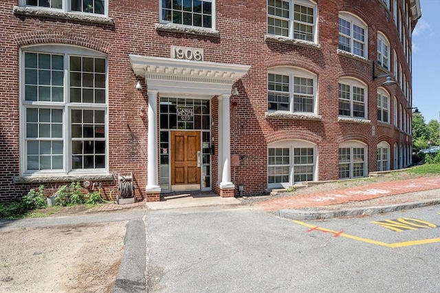 property entrance with brick siding