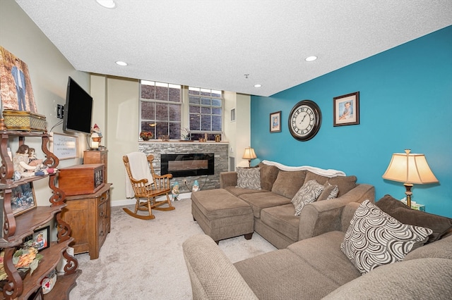 living room featuring light carpet, a stone fireplace, and a textured ceiling