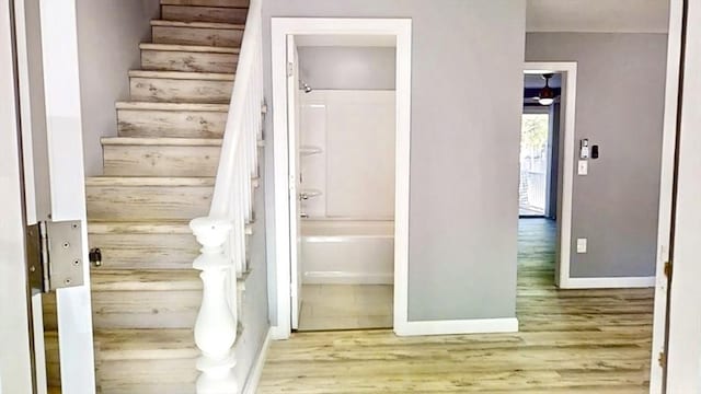 55 Mendon St, Worcester, MA 01604 - stairs featuring wood finished floors and baseboards