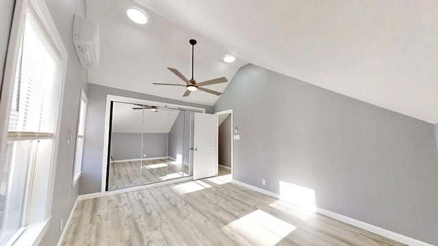 55 Mendon St, Worcester, MA 01604 - unfurnished room featuring vaulted ceiling, a ceiling fan, light wood finished floors, baseboards, and a wall unit AC