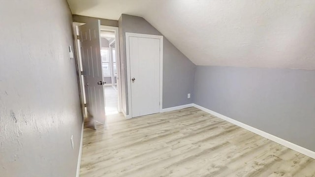 55 Mendon St, Worcester, MA 01604 - additional living space featuring vaulted ceiling, light wood finished floors, and baseboards
