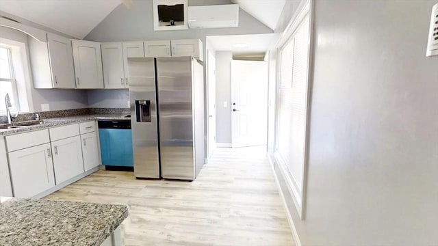 55 Mendon St, Worcester, MA 01604 - kitchen with appliances with stainless steel finishes, lofted ceiling, a sink, light wood-style floors, and light stone counters