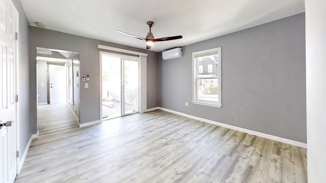 55 Mendon St, Worcester, MA 01604 - empty room with a wall mounted air conditioner, light wood-type flooring, baseboards, and ceiling fan