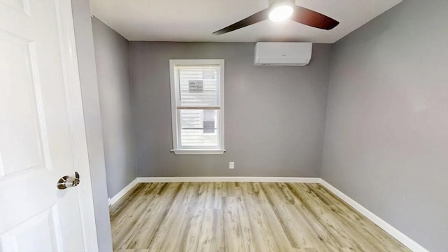 55 Mendon St, Worcester, MA 01604 - spare room with light wood-type flooring, a wall mounted air conditioner, baseboards, and ceiling fan