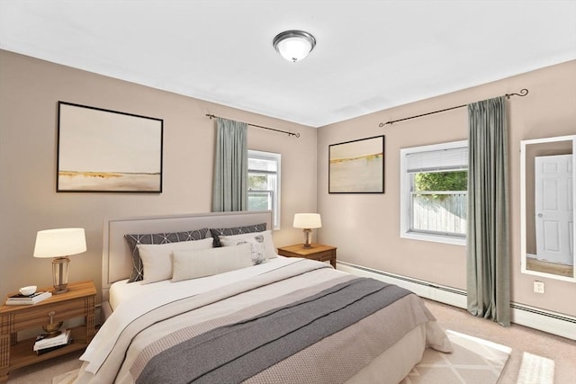 bedroom featuring a baseboard radiator and light carpet