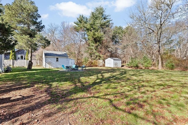view of yard with a shed and an outbuilding