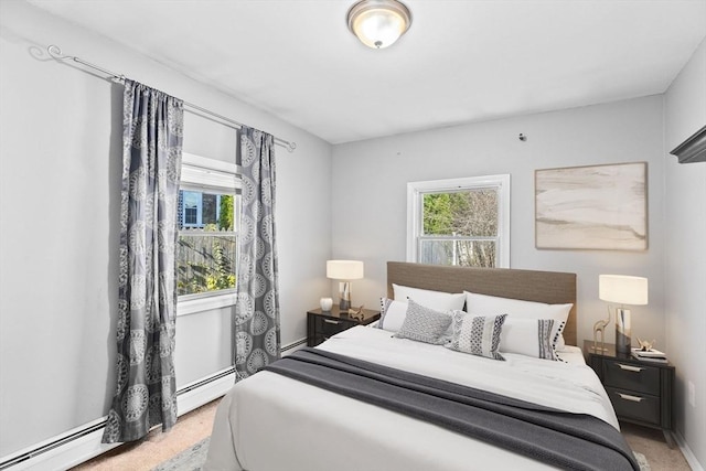 bedroom featuring light carpet and a baseboard radiator