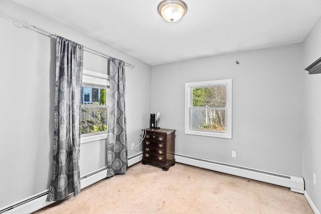 empty room featuring carpet flooring and a baseboard radiator