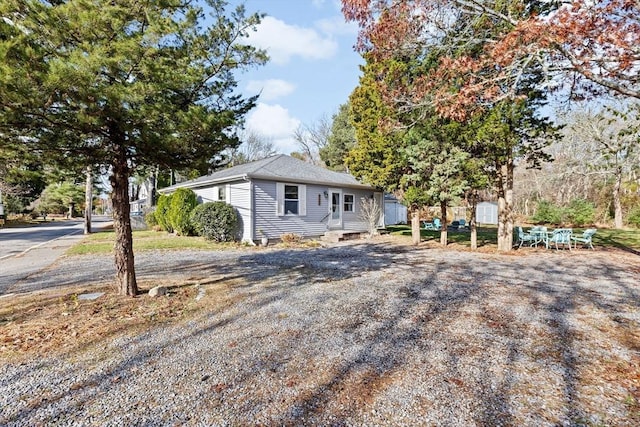 view of front of house featuring a shingled roof
