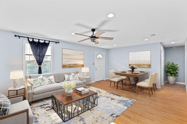 living room with attic access, ceiling fan, light wood finished floors, recessed lighting, and baseboards
