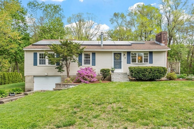 7 Squannacook Ter, Townsend, MA 01469 - single story home with a garage, a chimney, a front yard, roof mounted solar panels, and a shingled roof