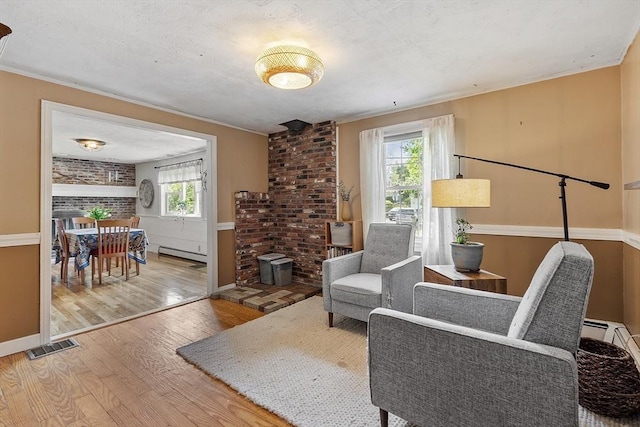 7 Squannacook Ter, Townsend, MA 01469 - sitting room featuring wood finished floors, a baseboard radiator, and baseboards