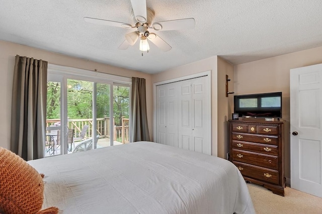 7 Squannacook Ter, Townsend, MA 01469 - bedroom with access to exterior, carpet flooring, a closet, a textured ceiling, and a ceiling fan