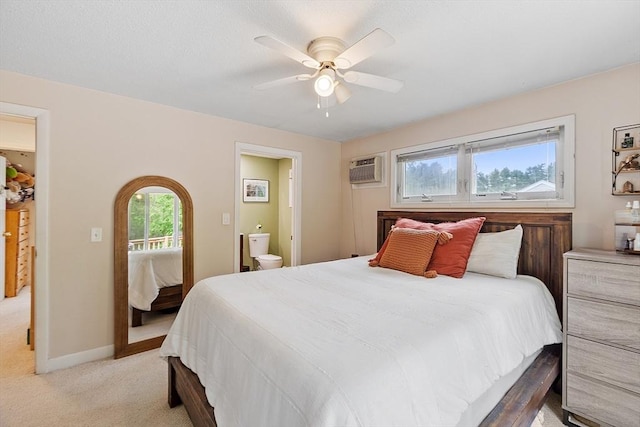 7 Squannacook Ter, Townsend, MA 01469 - bedroom with light colored carpet, a wall mounted air conditioner, ensuite bathroom, a ceiling fan, and baseboards