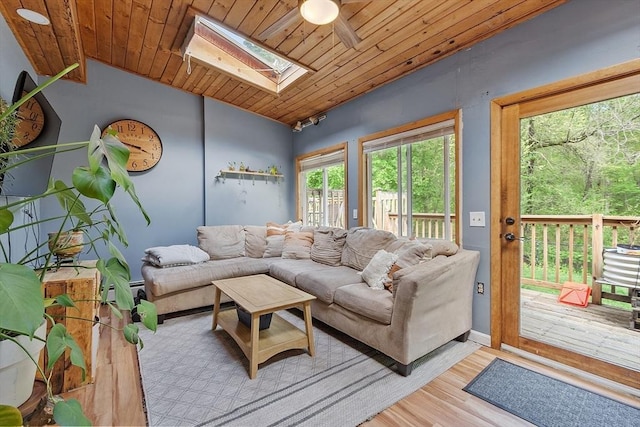 7 Squannacook Ter, Townsend, MA 01469 - living area featuring a skylight, lofted ceiling, wood ceiling, light wood-style flooring, and ceiling fan