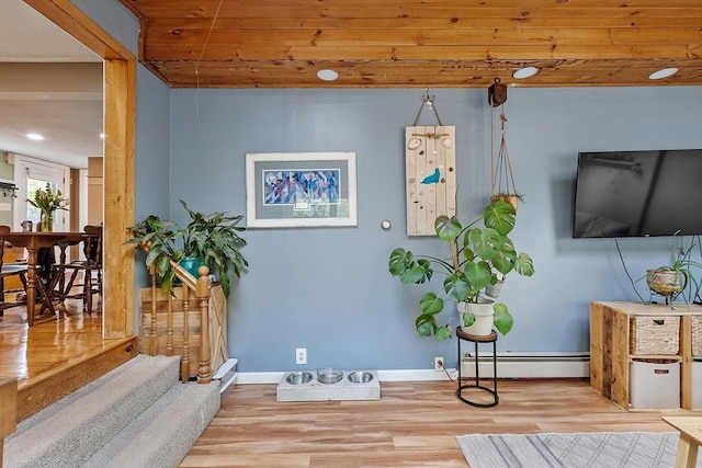 7 Squannacook Ter, Townsend, MA 01469 - sitting room with a baseboard heating unit, wood finished floors, and baseboards