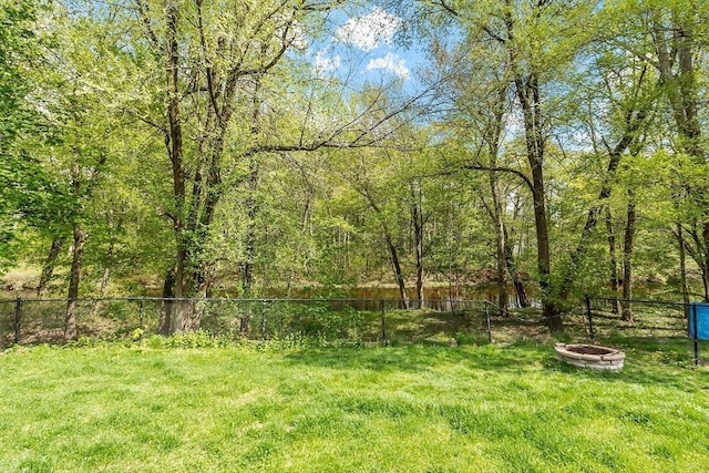 7 Squannacook Ter, Townsend, MA 01469 - view of yard featuring an outdoor fire pit and a wooded view