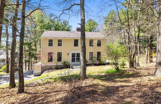 view of front of home featuring a chimney