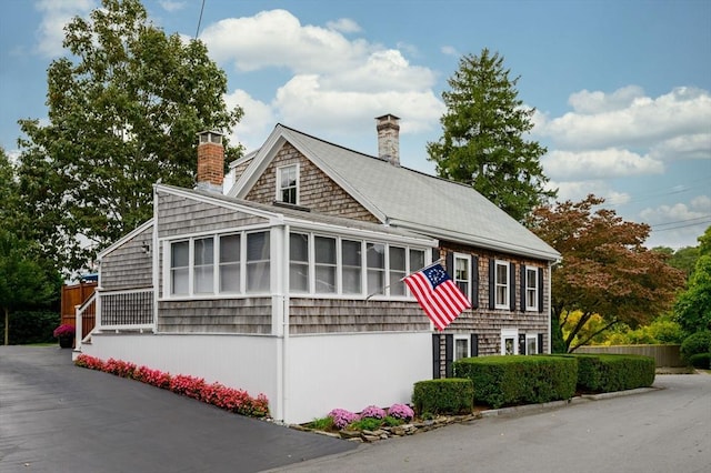 view of front of home featuring a sunroom