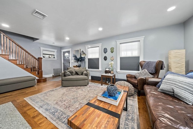 living room with radiator and wood-type flooring