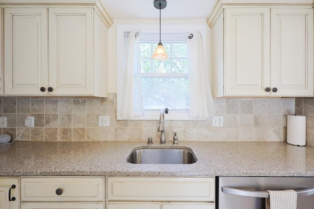 6 Minerva St, Swampscott, MA 01907 - kitchen featuring a sink, dishwasher, decorative backsplash, light stone countertops, and decorative light fixtures