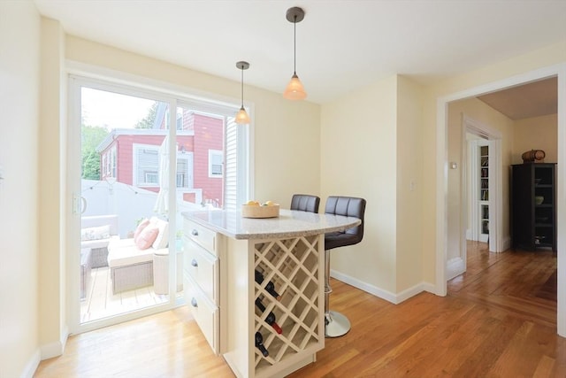 6 Minerva St, Swampscott, MA 01907 - dining area featuring baseboards and light wood-style floors