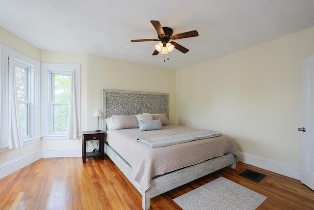 6 Minerva St, Swampscott, MA 01907 - bedroom featuring baseboards, wood finished floors, and a ceiling fan