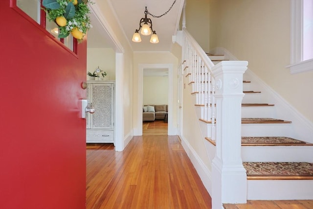 6 Minerva St, Swampscott, MA 01907 - entrance foyer with stairway, wood finished floors, and ornamental molding